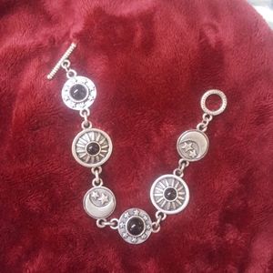 Silver tone with black faux onyx moon and star bra